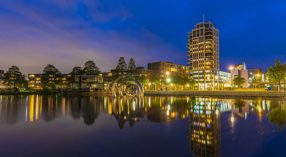 Zoetermeer downtown districtcity skyline office building and residential apartments during dusk